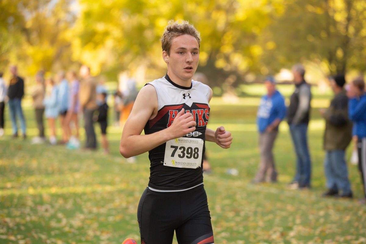 Zach Wenger looks ahead during the state cross country meet, finishing the race with a 20:33.