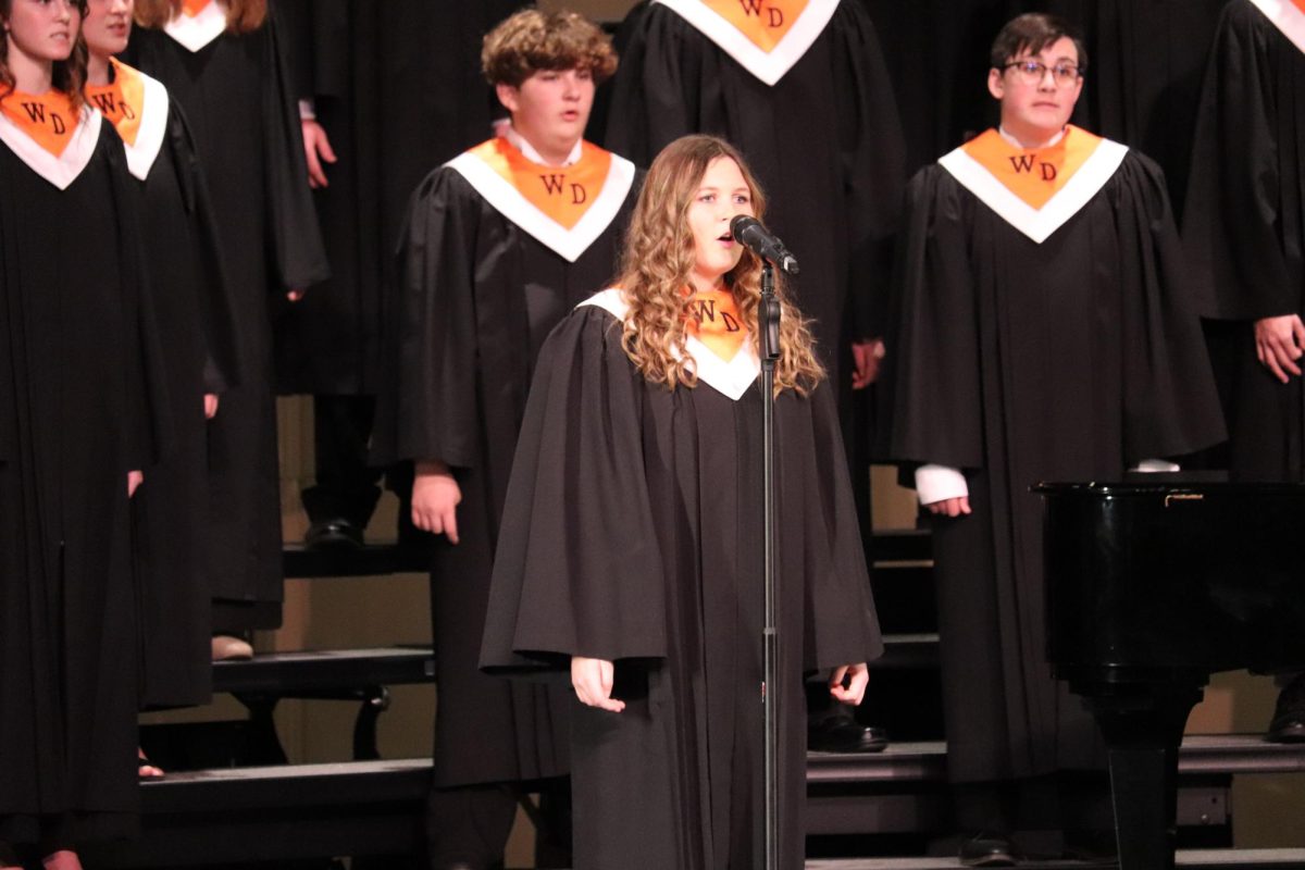 Natalie Palmer (9) sings a solo during the December Christmas concert.