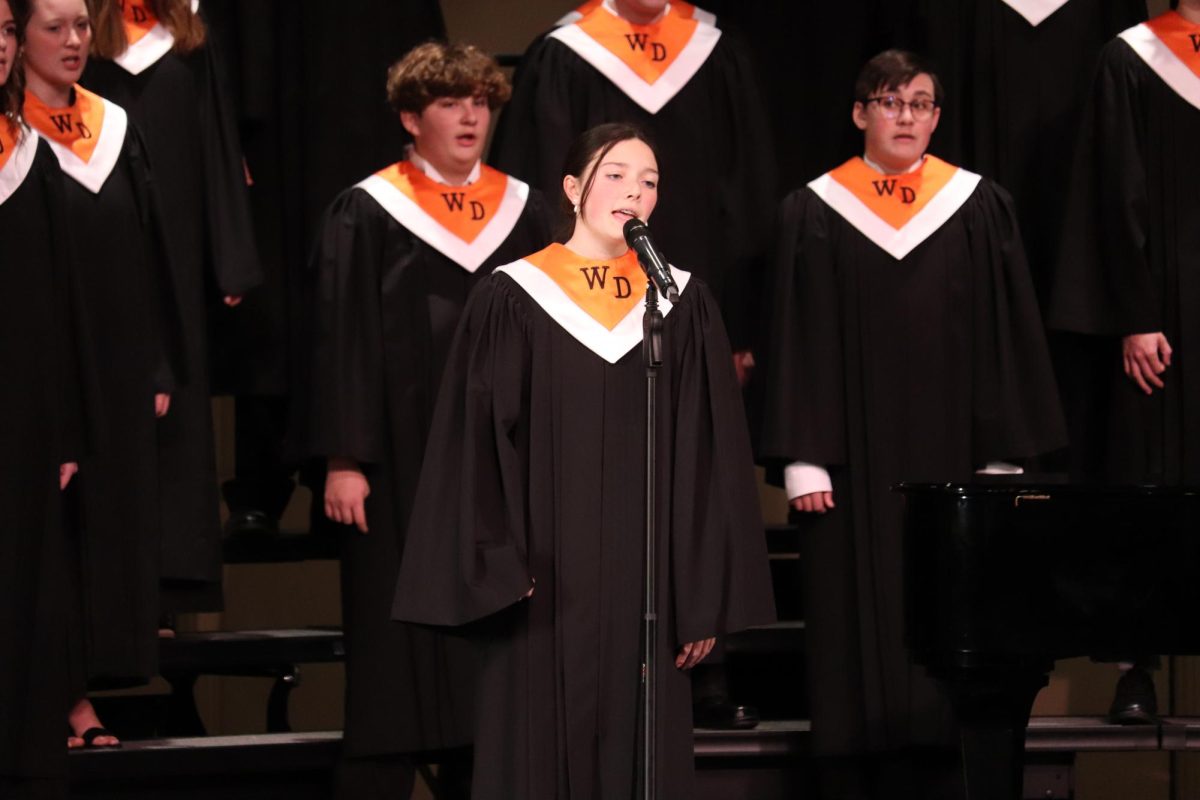 Erin Menson (10) sings a solo from the song Christmastime at the December Holiday concert