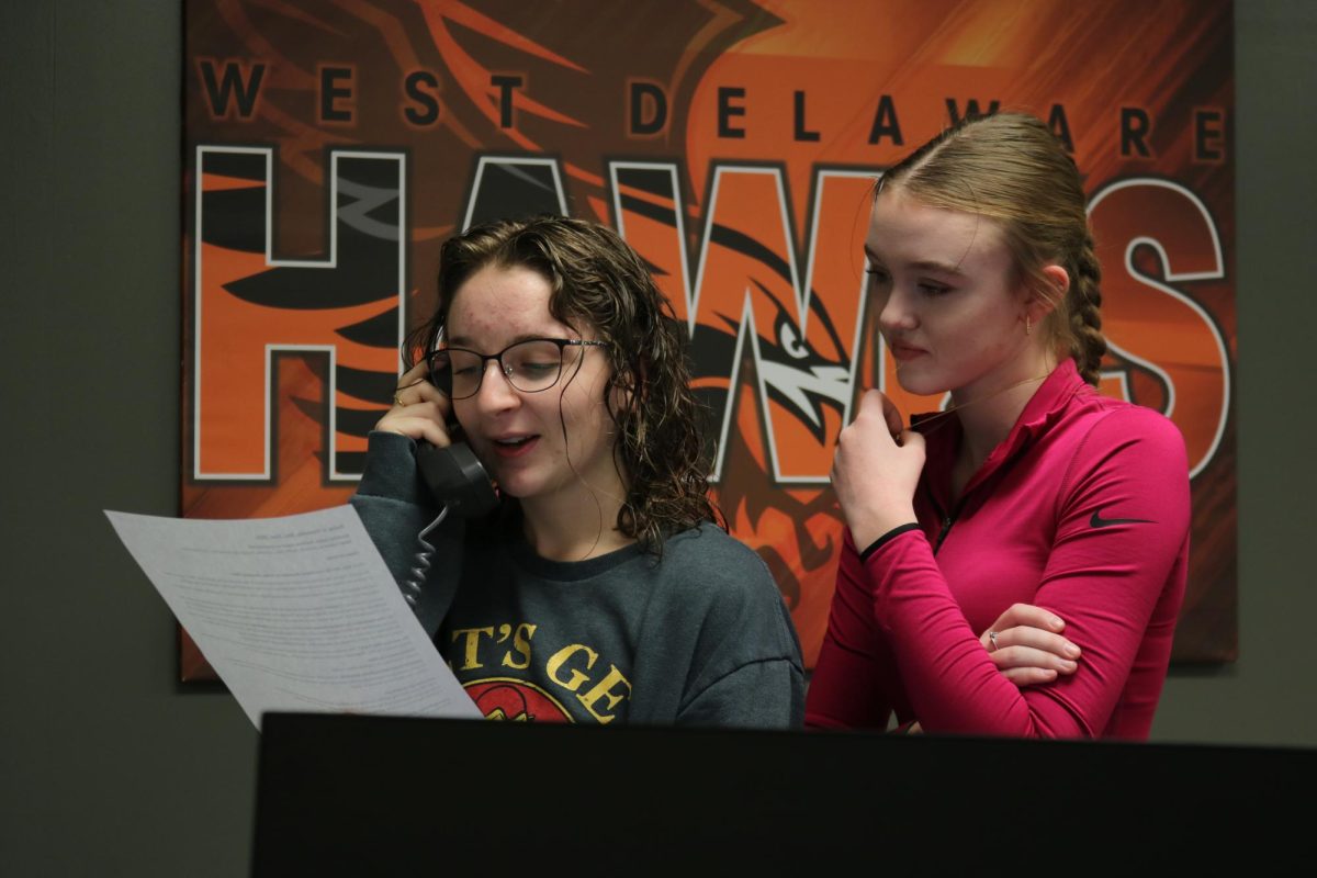 Audrey Jolley (12) and Noelle Bardgett (12) read the morning announcements.