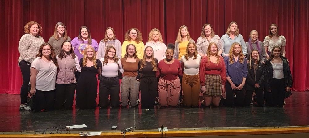 On the All-State Showcase night, the girls and their moms pose for a picture. Senior Noelle Bardgett filled in as Amelia Schnieders mom as she wasnt able to be there. 