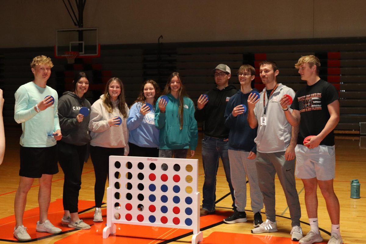 Jake Voss homeroom poses for a picture after winning Connect Four tournament.