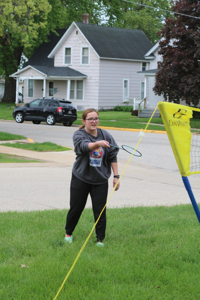 Bridget Heideman (10) plays badminton in the nice weather during the school block party.