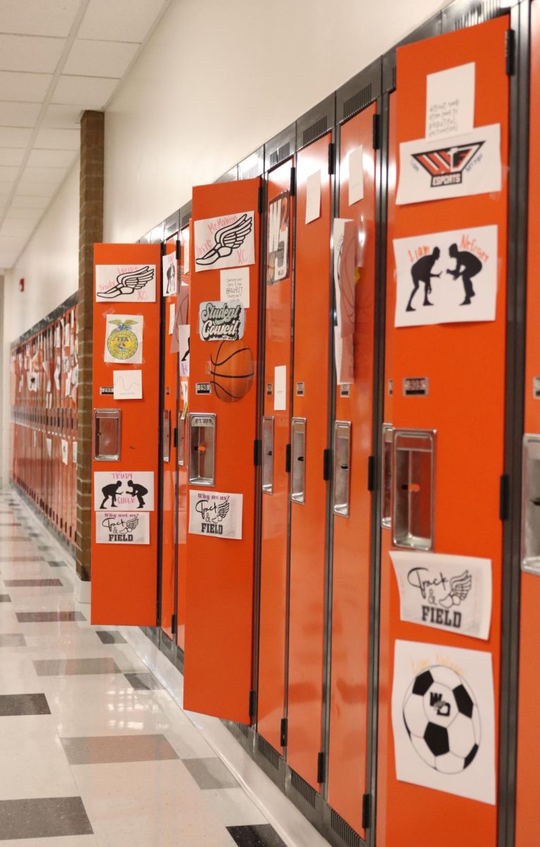 Student council displays locker tags for students who are in extracurricular activities. 