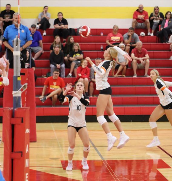 On Tuesday night, junior Lauren LeClere aims to hit the ball during the varsity match against Marion. LeClere accumulated 10 kills that night, helping the Hawks win 3-1.