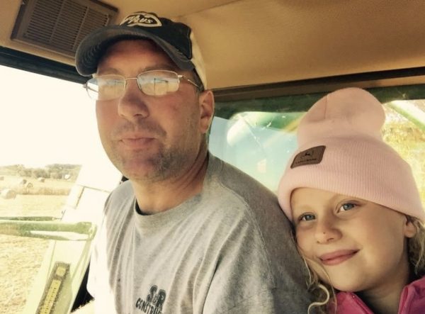 As an eight-year-old, Ava Pettlon rides in the combine with her dad, Mike Pettlon.
(Photo Contributed)