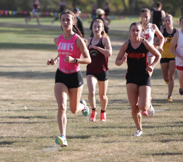 Brynn Kartman (10) leads a pack at the Hawk's home meet. Kartman placed 20th with a time of 20:31.46