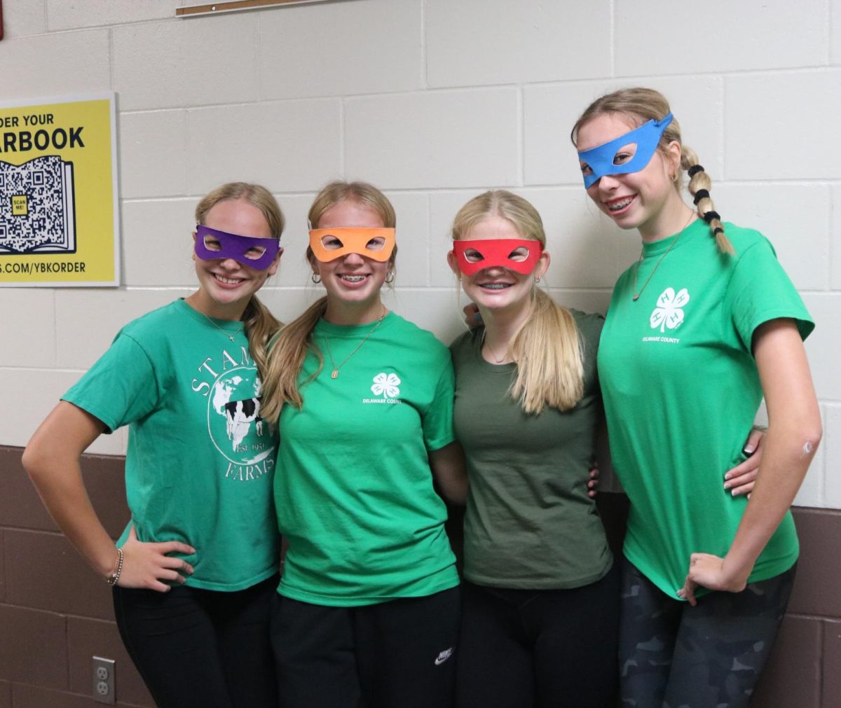 For TV Show day during Homecoming Week, freshmen Emma Millenkamp, Claire Smith, Olivia White, and Olivia Quint dress up as Ninja Turtles. "It was so much fun dressing up with my friends," Millenkamp said. 