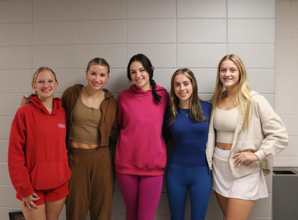 With Thursday's monochrome theme, Alexis Hickson (9), Josie McMahon (12), Avery Rausch (12), Andrea Kann (12), and Susan Funke (12) each dress in one color to show their school spirit. Other dress-up days included TV show day and PJ day.