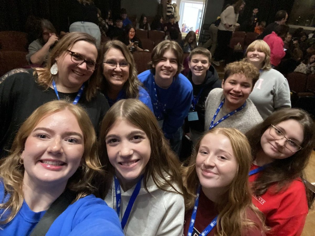 On Nov. 15, A group of thespians gather in the UNI auditorium to watch “Zombie Prom.” with other theater troupes. Front Row: Claire Manson (12), Jeanne Bargette (9), Makayla Seeley (10), Baylea Hutchinson (10); Back Row: Jennifer Lamb, Tina Ostrander, Eli Shipley (10), Kaidyn Robbins (9), Keizel Rivera (10), Sophia Hegland (11).
