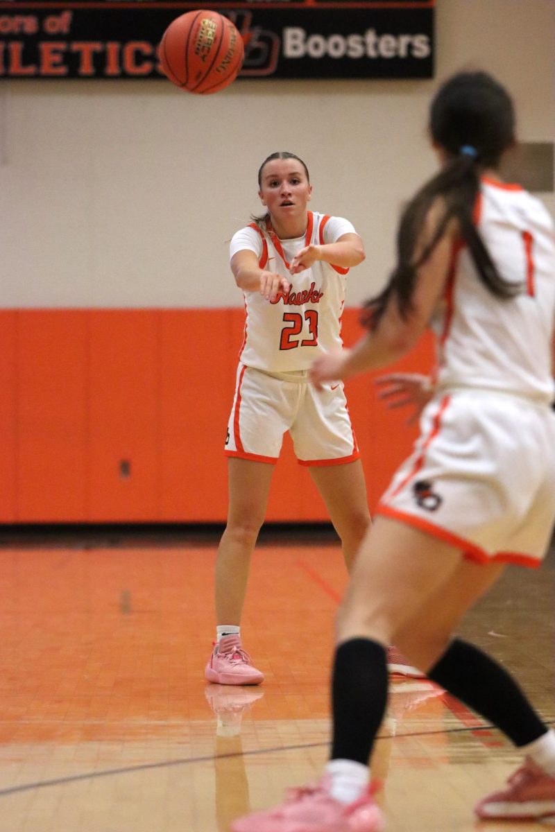 During the Maquoketa Valley game on Nov. 22, Josie McMahon (12) passes to teammate Kirstyn Kolbet (12). The girls varsity won, 37-31. 