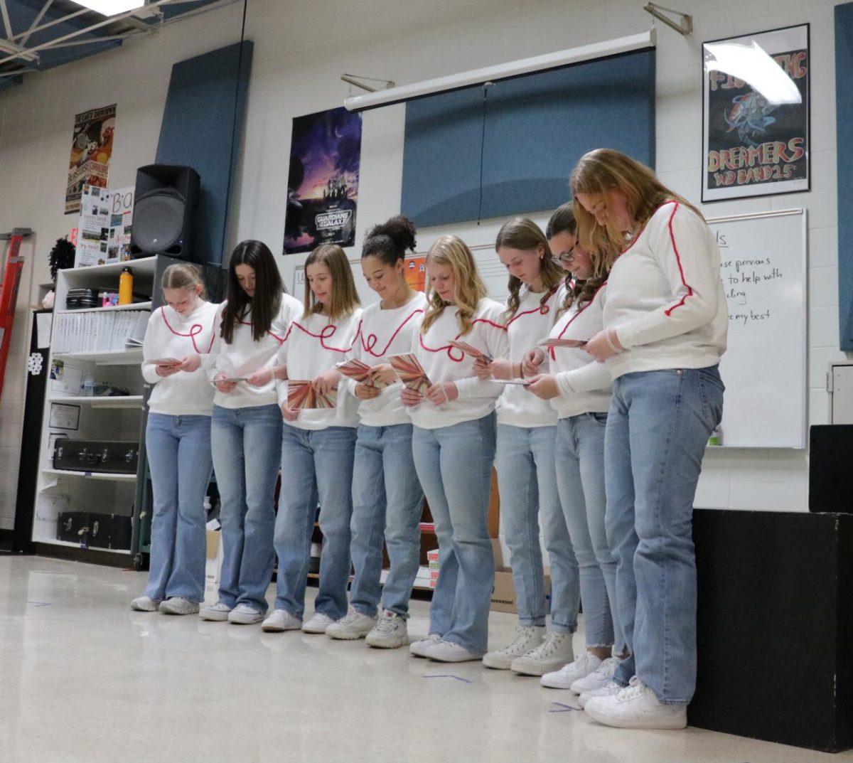 Kate Ries (10),  Erin Mensen (11), Madison Felderman (10), Tiana Washington (12), Ali Robinson (12), Avery Schultz (10), Natalie Palmer (10), and Claire Manson (12) perform their choral reading to judges at the WaMaC speech competition. West Delaware placed second out five schools. 