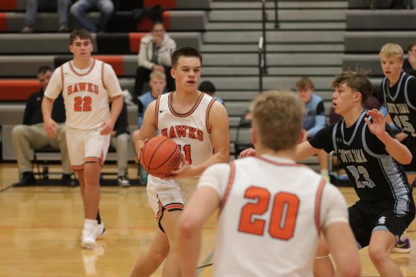 Senior Levi Wilson-Bries looks to pass to teammate Austin Schnieders (11). Wilson-Bries has the highest three-point percentage on his team, shooting 38.9%.