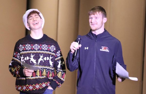 Christian Timmerman (12) and Joshua Sleper (9) announce the rules of the game to the student body.