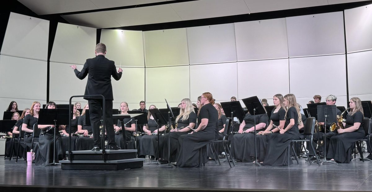 Director Jonathan Green conducts the band. 