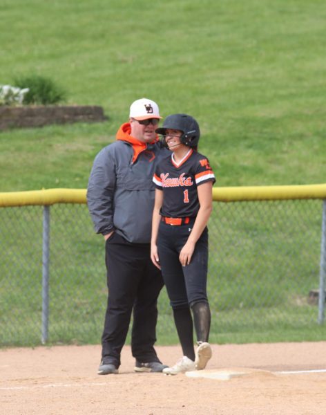 Coach Ryan King instructs Lena Pettlon (11) on third during the Ed-Co scrimmage. 