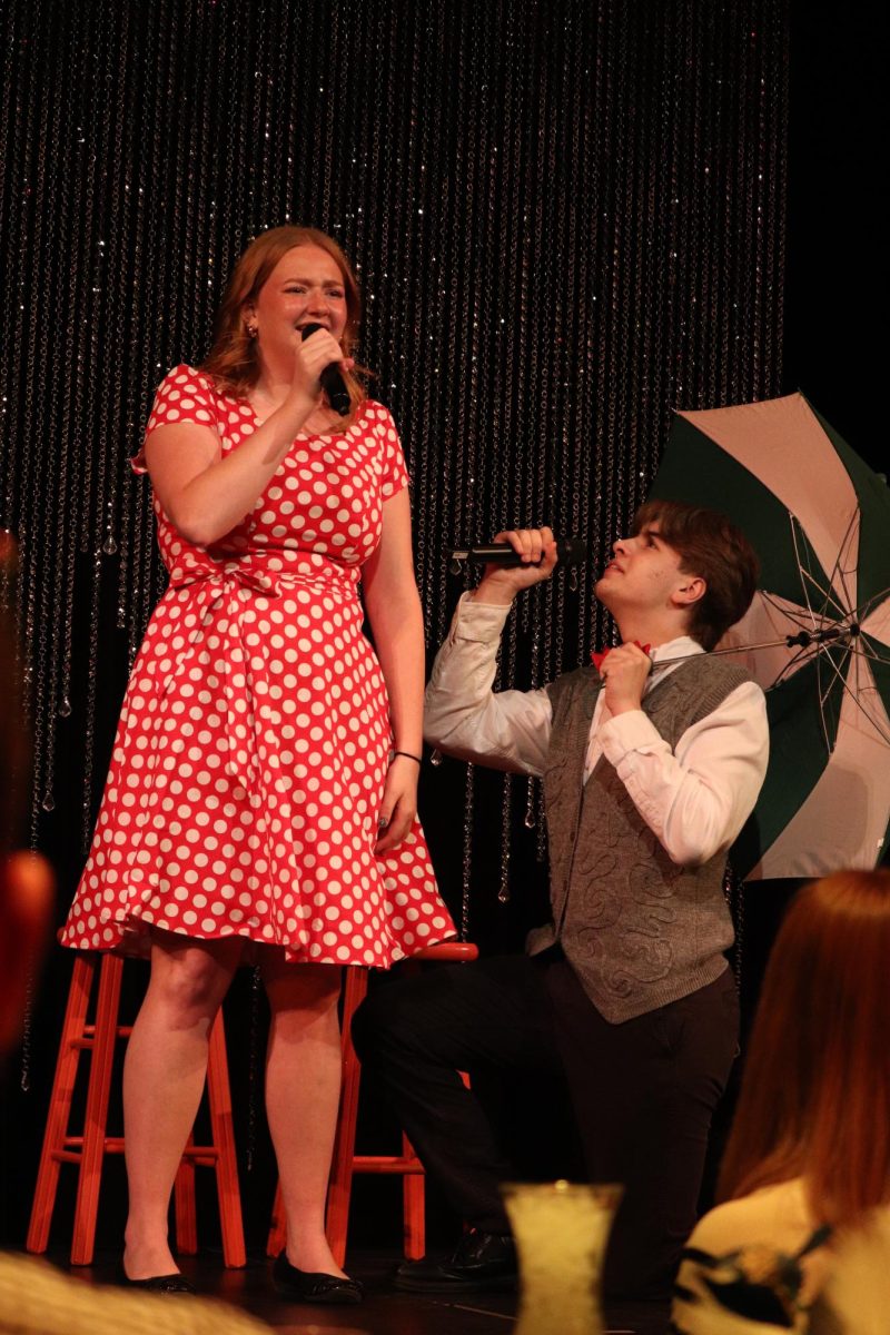 Senior Claire Manson and sophomore Eli Shipley sing with emotion to each other as they perform their duet.