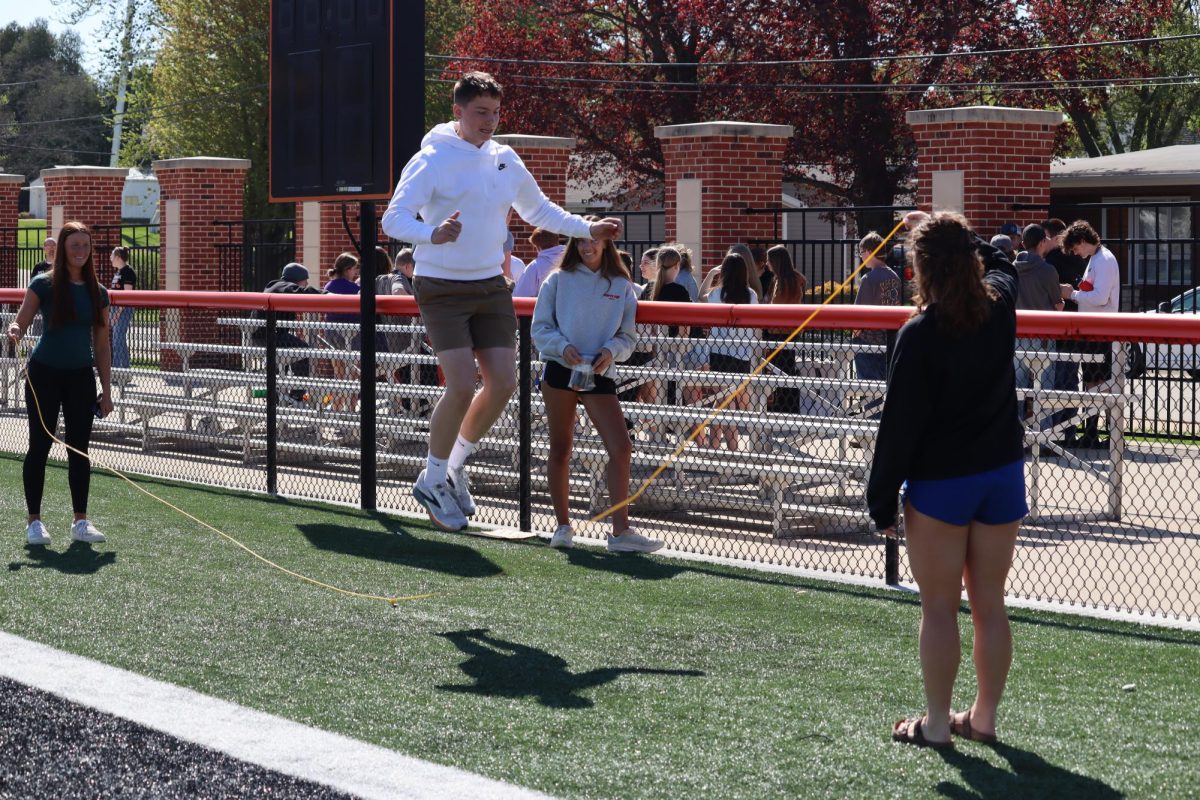 Junior Grady Millenkamp jumps over the rope. MillenKamp jumped a total of seven times winning three chips for his homeroom.