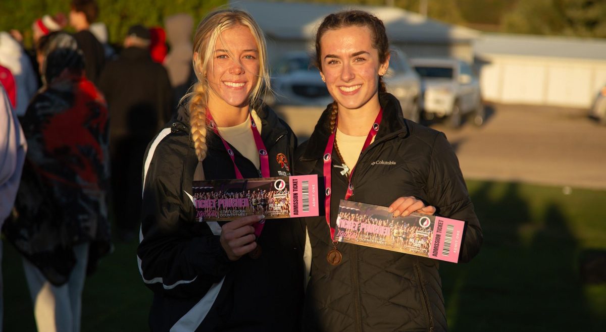 Brynn Kartman (11) and Norah Peyton (12) show off their state qualifier tickets. (Photo contributed by Lori Kartman.)