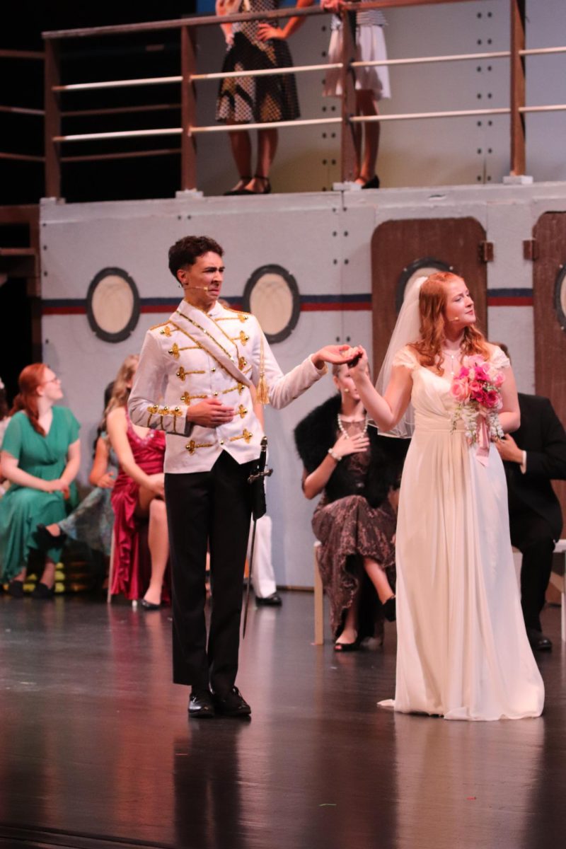 While reciting their vows, Trent Menard (12) and Makayla Seeley (11) express different emotions. 