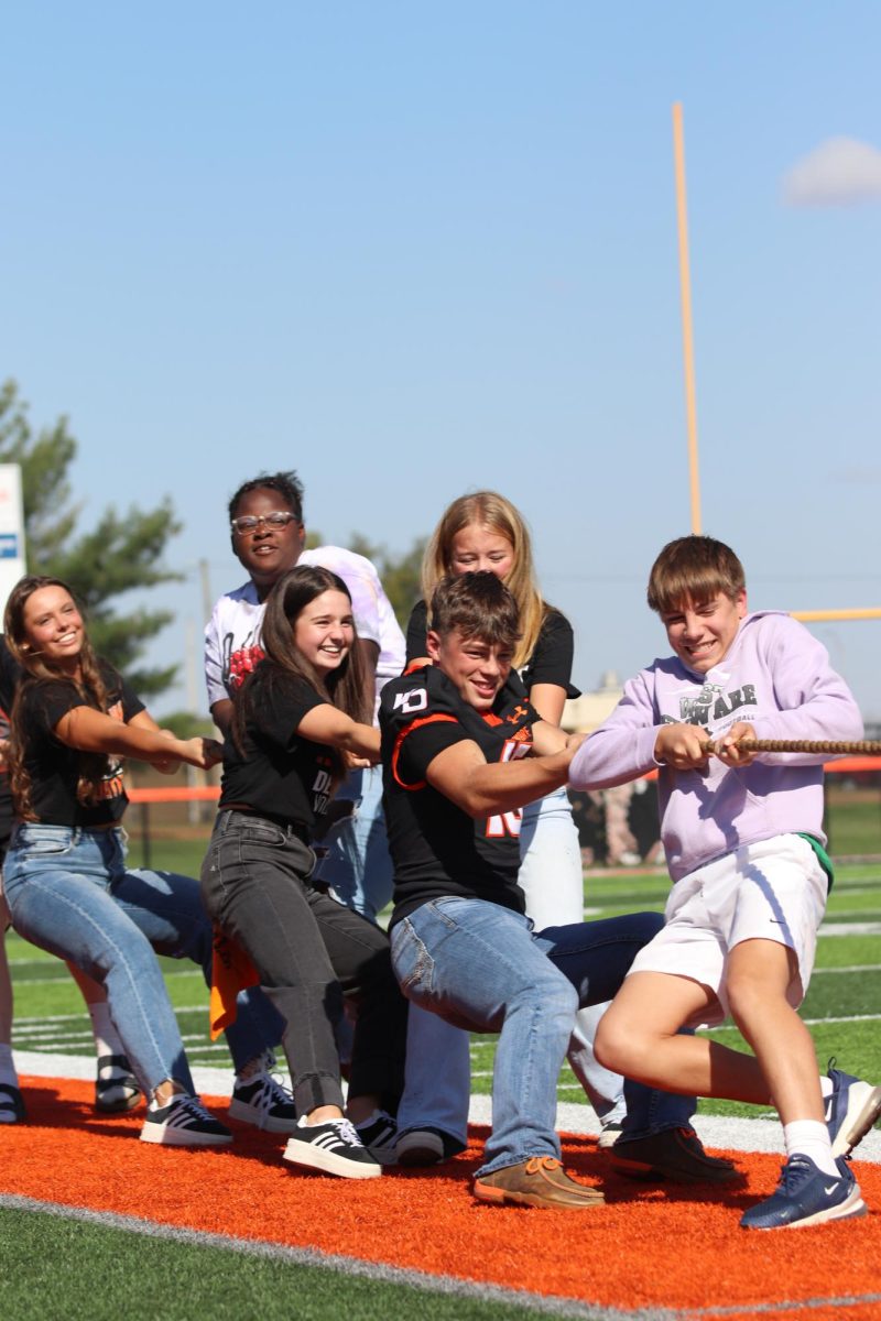 Sophomores Karly Ogden, Tamara Pittman, Joslyn Hess, Claire Smith, Lane Gudenkauf, and Sladen Shover use their strength to win against the freshmen during tug of war.