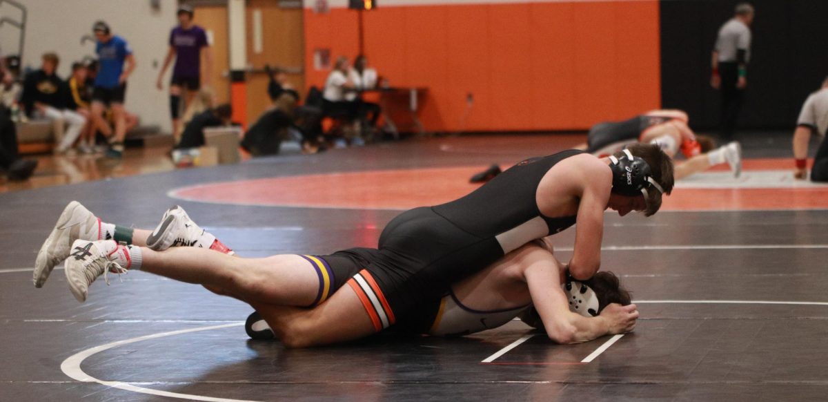 Against Indianola, Colten Roling (10) finishes the match, 10-0, winning the bracket. Roling finished the tournament, 3-0. 