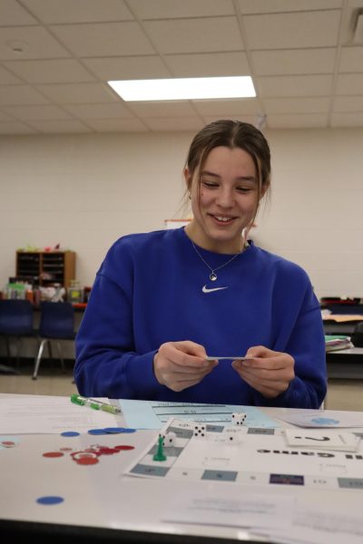 Reading off of a card, Kaci Reth (10) participates in the Cell Cycle Game.