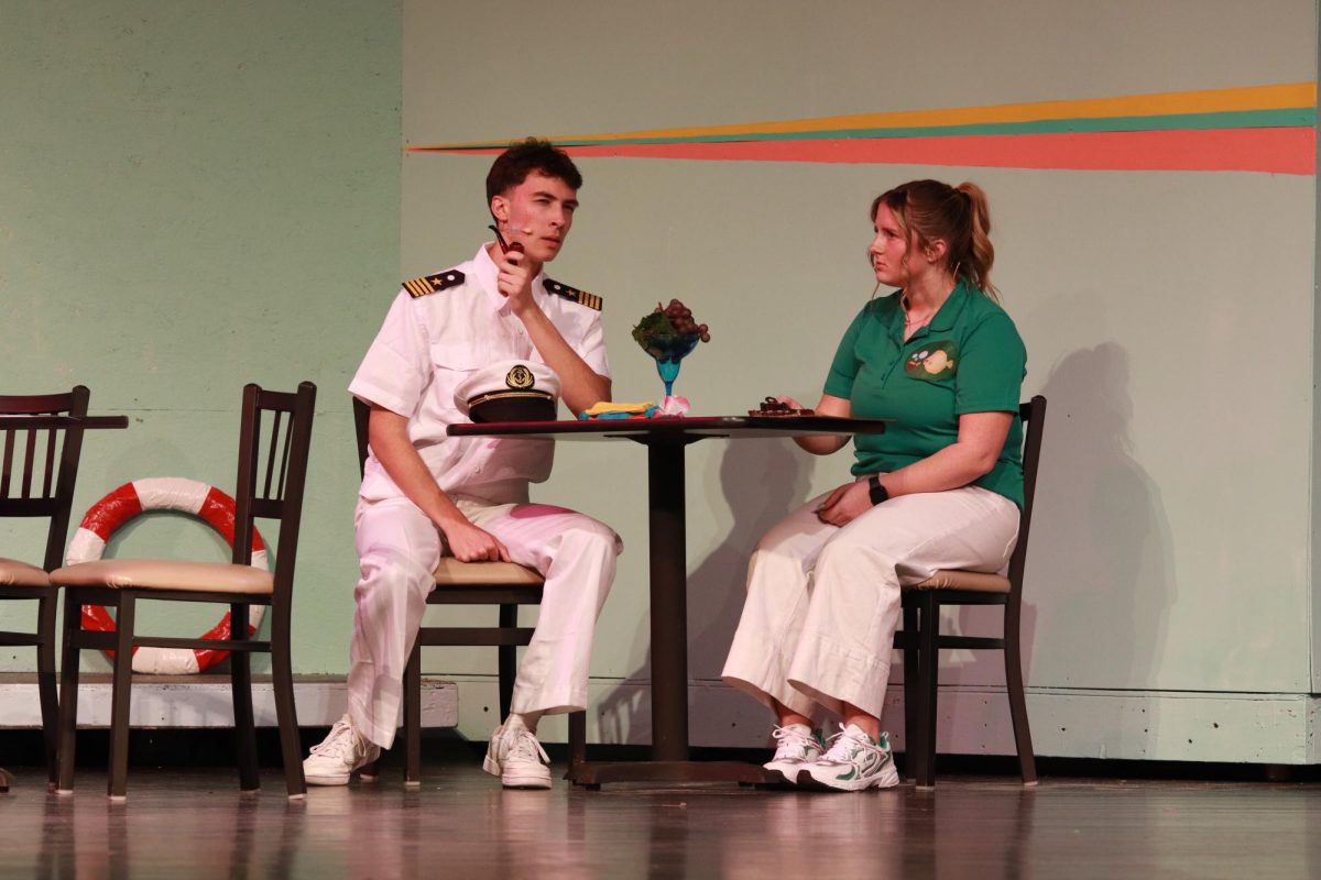 On the deck, Reagan Reeder (12), as the Purser, listens to Trent Menard (12), as Captain Creeg, talks about his fear of June 10.
