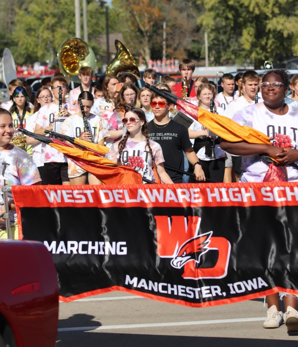 The West Delaware Pride Marching Band plays the fight song during the homecoming parade. 
