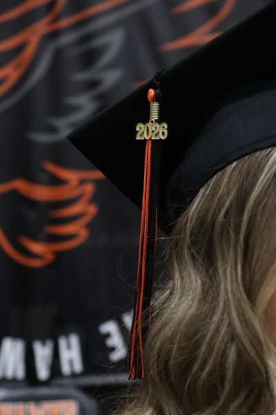 Maggie Lyness's 2026 graduation tassel on stage.