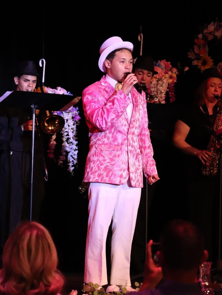 Playing with the band, Keizel Rivera Lopez (11) sings “Sway” by Michael Bublé for the dinner show.